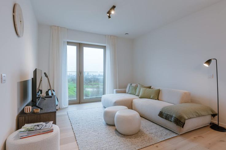 Ostend OstendのBuilding Troonstraat - huswell - 1293864 - BRUのアパートメントにある、モダンな家具を備えたエレガントなデザインのリビングルーム