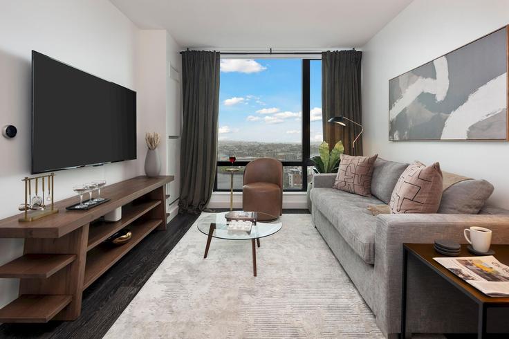 Elegantly designed living room with modern furnishings in an apartment at Building New Street - hyatus-living - 1383008 in Boston, Boston