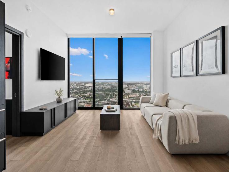 Elegante sala de estar con mobiliario moderno en un apartamento en Building Northeast 11th Street - ilios-rentals - 1621145 en Miami, Miami Elegante sala de estar con mobiliario moderno en un apartamento en Building Northeast 11th Street - ilios-rentals - 1621145 en Miami, Miami