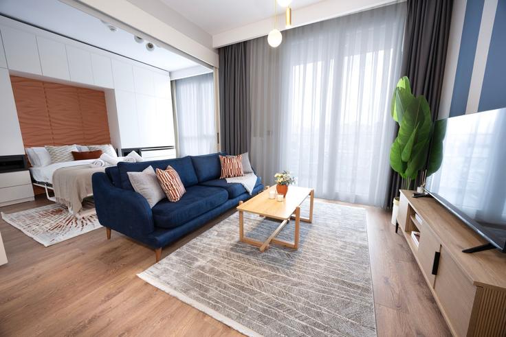 Salle de séjour élégante avec mobilier moderne dans un appartement à Building Bahar Caddesi - ipmhomes - 1502884 à Bağcılar, İstanbul