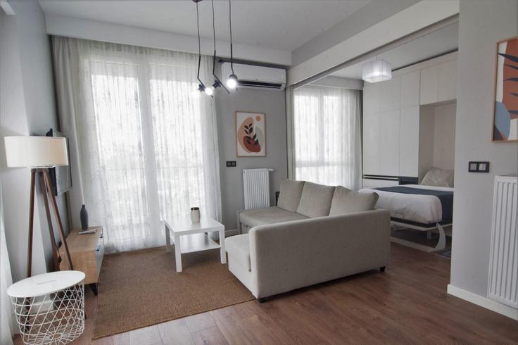 Salle de séjour élégante avec mobilier moderne dans un appartement à Building Bahar Caddesi - ipmhomes - 1335818 à Bağcılar, İstanbul Salle de séjour élégante avec mobilier moderne dans un appartement à Building Bahar Caddesi - ipmhomes - 1335818 à Bağcılar, İstanbul