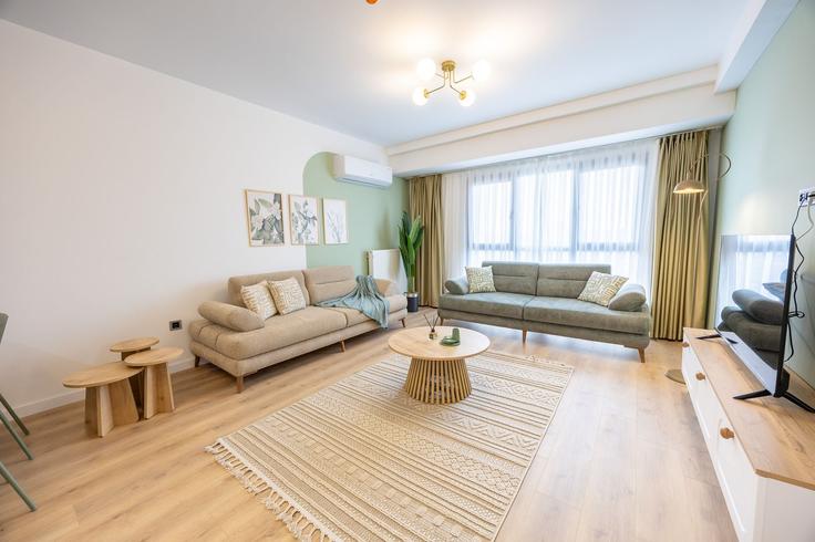 Salle de séjour élégante avec mobilier moderne dans un appartement à Building Bahar Caddesi - ipmhomes - 1502883 à Bağcılar, İstanbul