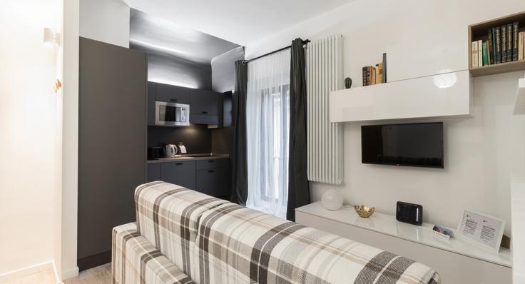 Elegante sala de estar con mobiliario moderno en un apartamento en Building Via Gustavo Fara - italianway-spa - 1538233 en Milan, Milan Elegante sala de estar con mobiliario moderno en un apartamento en Building Via Gustavo Fara - italianway-spa - 1538233 en Milan, Milan