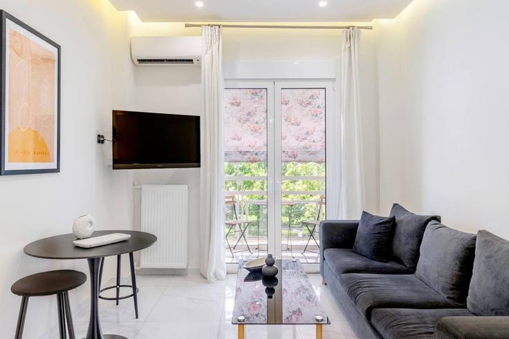 Elegantly designed living room with modern furnishings in an apartment at Building Kallirrois - ivy-vacation-rentals - 1503049 in Central Athens, Athens