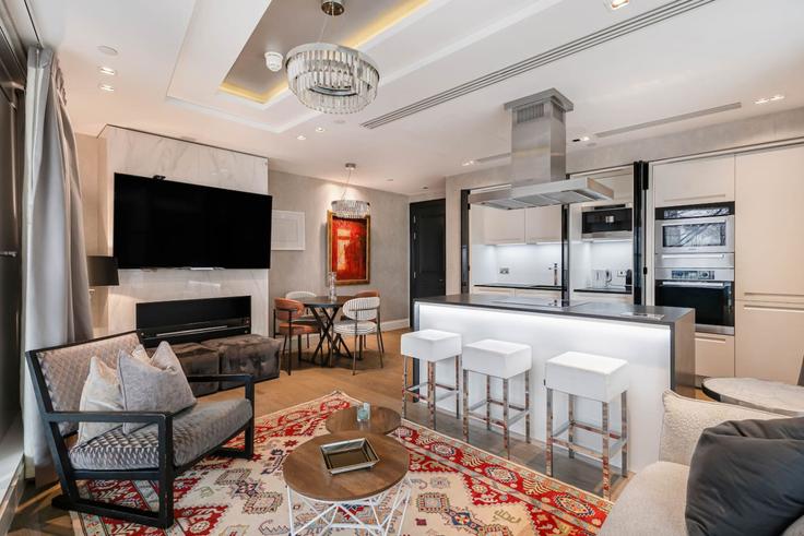 Salle de séjour élégante avec mobilier moderne dans un appartement à Building Kensington High Street - kenton-hostaway - 1373015 à Royal Borough of Kensington and Chelsea, London Salle de séjour élégante avec mobilier moderne dans un appartement à Building Kensington High Street - kenton-hostaway - 1373015 à Royal Borough of Kensington and Chelsea, London