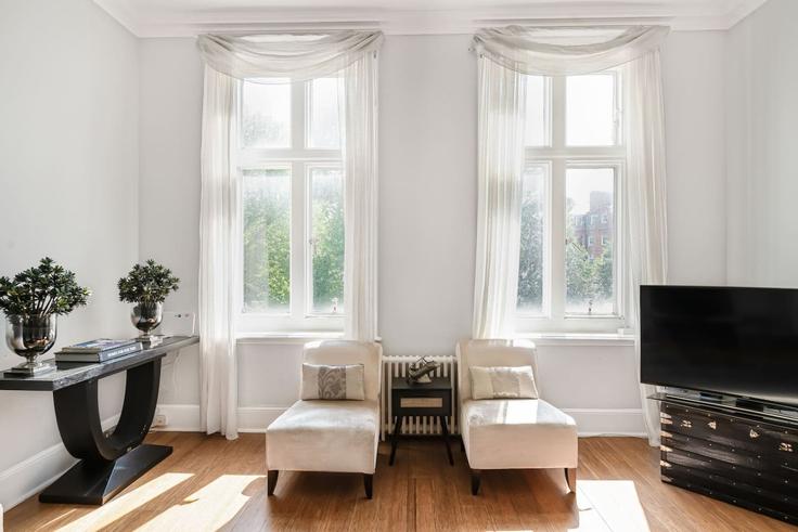 Elegantly designed living room with modern furnishings in an apartment at Building Lennox Gardens - kenton-hostaway - 1539513 in Royal Borough of Kensington and Chelsea, London