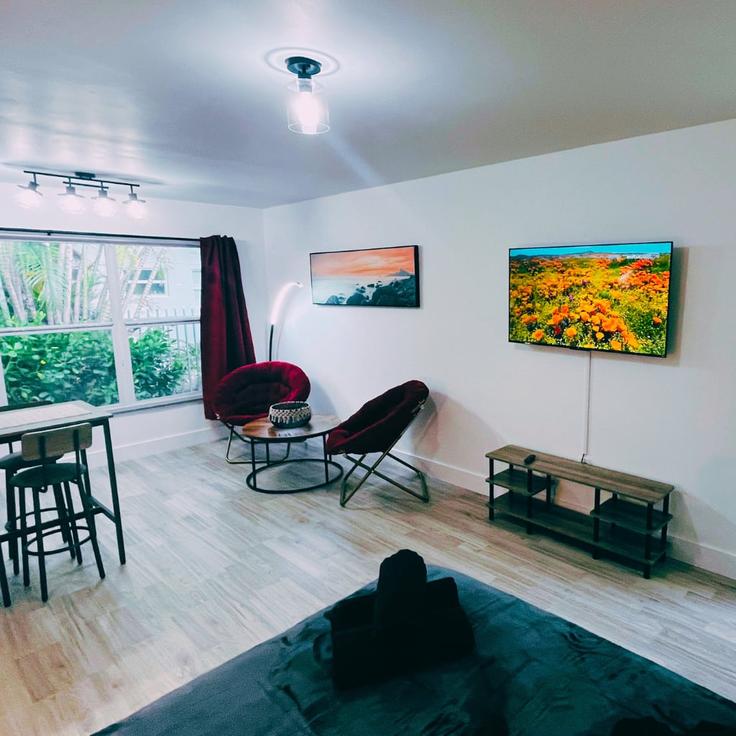 Elegantly designed living room with modern furnishings in an apartment at Building Northeast 80th Street - kohcoon-llc - 1633096 in Miami, Miami