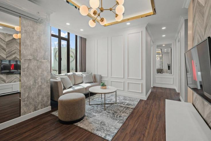 Sala de estar elegantemente projetada com móveis modernos em um apartamento no Building Jalan Asia Afrika - kozystay-1 - 1542540 em Lengkong, Bandung City Sala de estar elegantemente projetada com móveis modernos em um apartamento no Building Jalan Asia Afrika - kozystay-1 - 1542540 em Lengkong, Bandung City