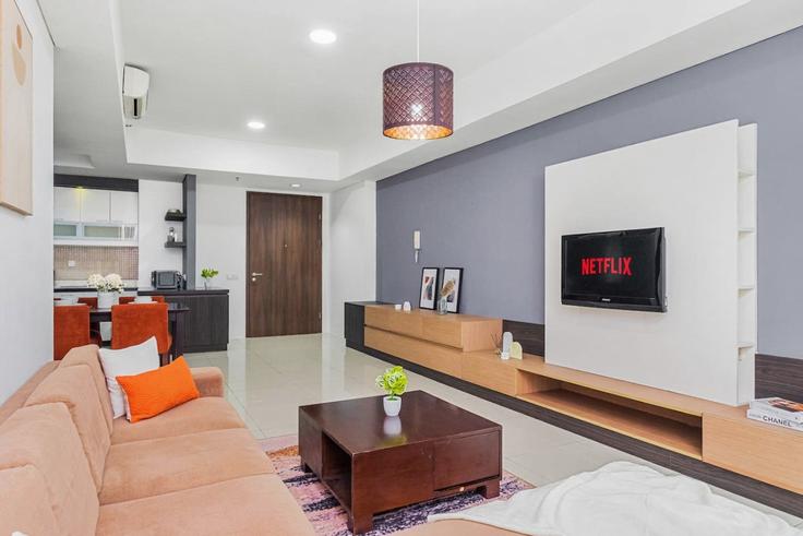 Salle de séjour élégante avec mobilier moderne dans un appartement à Building Jalan Kemang VI - kozystay-1 - 1529366 à Mampang Prapatan, South Jakarta City Salle de séjour élégante avec mobilier moderne dans un appartement à Building Jalan Kemang VI - kozystay-1 - 1529366 à Mampang Prapatan, South Jakarta City