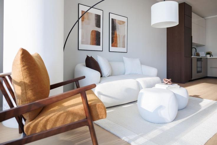 Elegante sala de estar con mobiliario moderno en un apartamento en Building Wagramer Straße - kpa-immobilien-gmbh - 1255962 - VIE en Vienna, Vienna
