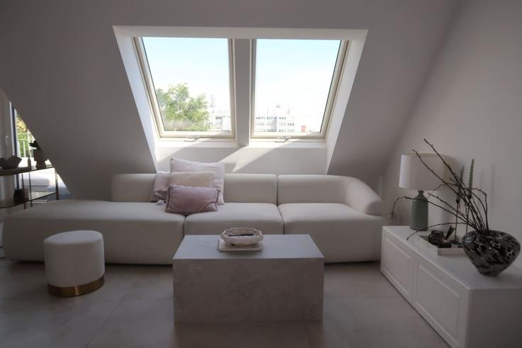 Elegantly designed living room with modern furnishings in an apartment at Building Sampogasse - kpa-immobilien-gmbh - 1568755 in Vienna, Vienna