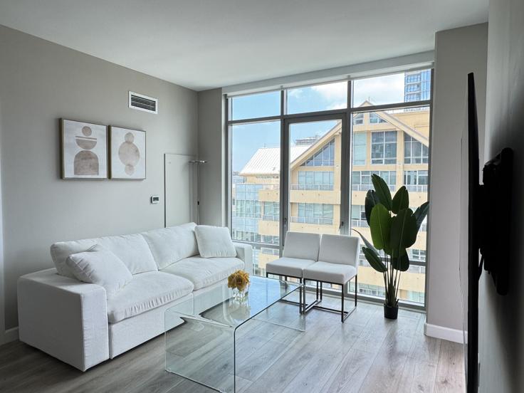 Elegantly designed living room with modern furnishings in an apartment at Building State Street - kubandaproperties - 1288270 - SAN in San Diego, San Diego