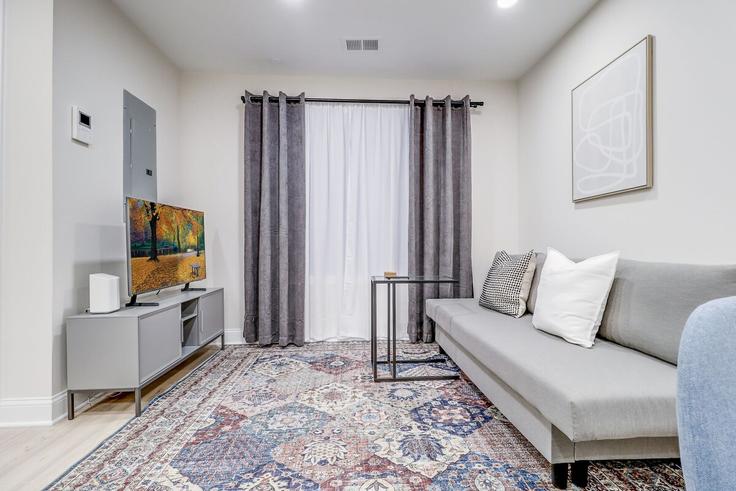 Elegantly designed living room with modern furnishings in an apartment at Building Kennedy Street Northwest - leyla-matt - 1582341 in Washington, Washington