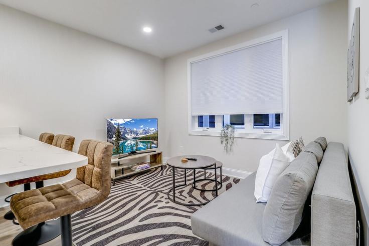Elegantly designed living room with modern furnishings in an apartment at Building Jefferson Street Northwest - leyla-matt - 1582333 in Washington, Washington