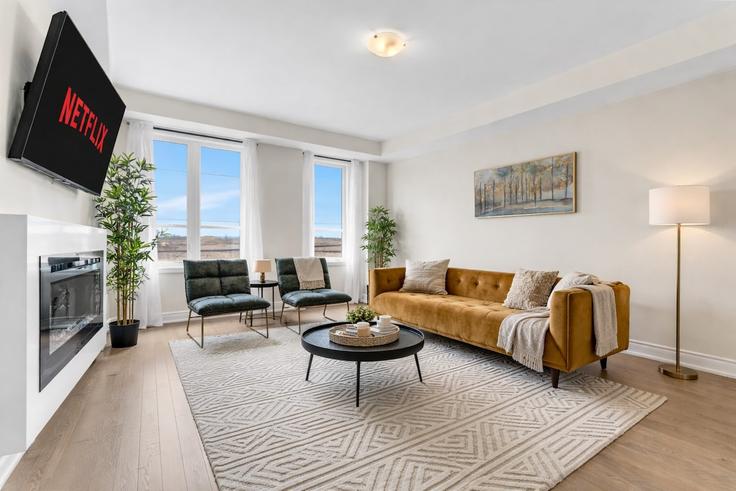 Oakville OakvilleのBuilding Sixth Line - likehouse-properties - 1648809のアパートメントにある、モダンな家具を備えたエレガントなデザインのリビングルーム Oakville OakvilleのBuilding Sixth Line - likehouse-properties - 1648809のアパートメントにある、モダンな家具を備えたエレガントなデザインのリビングルーム