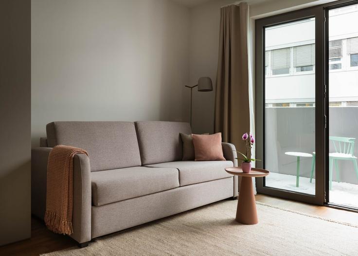 Elegantly designed living room with modern furnishings in an apartment at Building Vivenotgasse - limehome - 1573779 in Vienna, Vienna