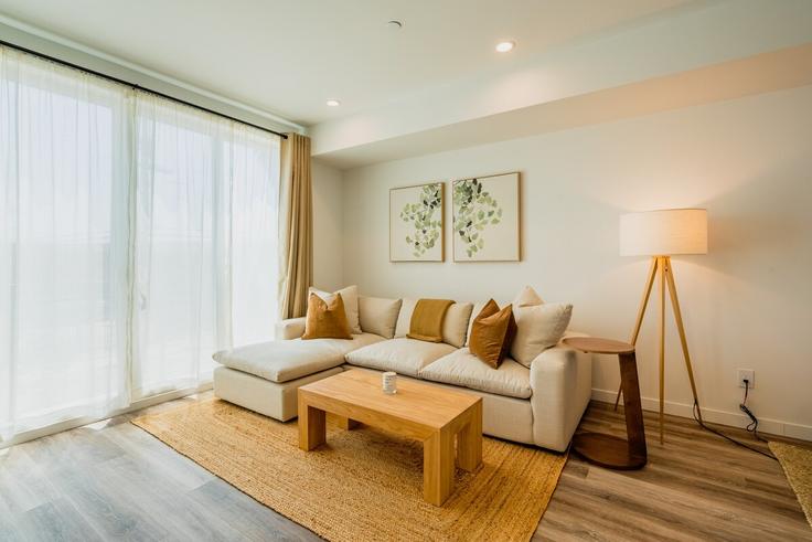 Elegantly designed living room with modern furnishings in an apartment at Building Thurman Avenue - little-hut-housing - 1255759 - LAX in Los Angeles, Los Angeles Elegantly designed living room with modern furnishings in an apartment at Building Thurman Avenue - little-hut-housing - 1255759 - LAX in Los Angeles, Los Angeles