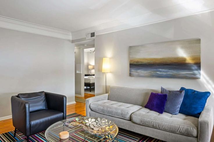 Elegantly designed living room with modern furnishings in an apartment at Building Standish Avenue Northwest - livly-housing - 1249179 in Atlanta, Atlanta