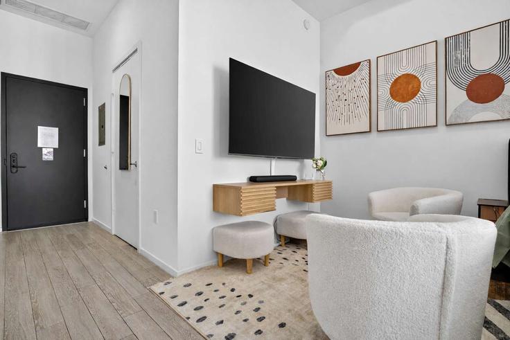 Elegantly designed living room with modern furnishings in an apartment at Building Northeast 2nd Avenue - livly-housing - 1583642 in Miami, Miami Elegantly designed living room with modern furnishings in an apartment at Building Northeast 2nd Avenue - livly-housing - 1583642 in Miami, Miami