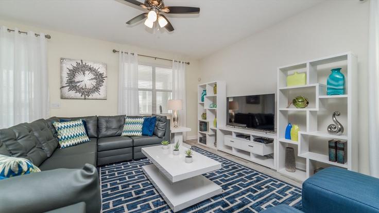 Elegante sala de estar con mobiliario moderno en un apartamento en Building Hazard Street - livly-housing - 1246805 - USA en Four Corners, Four Corners