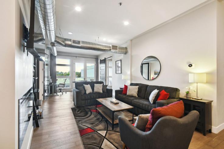 Elegantly designed living room with modern furnishings in an apartment at Building Blake Street - livly-housing - 1249121 - DEN in Denver, Denver