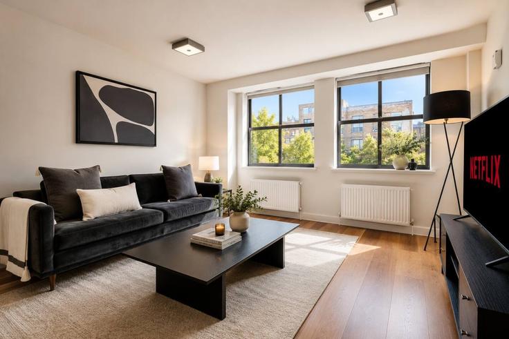 Sala de estar elegantemente projetada com móveis modernos em um apartamento no Building King Street - lls - 1574565 em City of London, London Sala de estar elegantemente projetada com móveis modernos em um apartamento no Building King Street - lls - 1574565 em City of London, London
