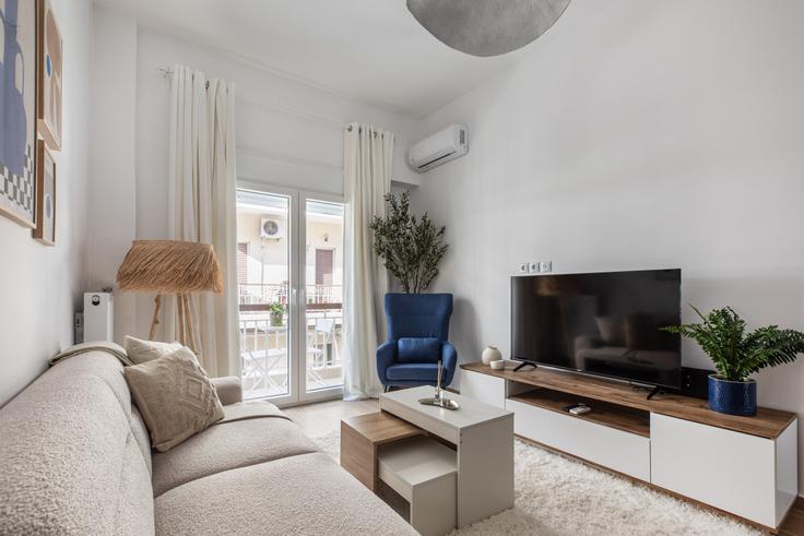 Elegantly designed living room with modern furnishings in an apartment at Building Tourmer - localhost - 1225933 in Central Athens, Athens