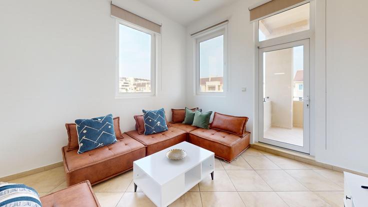 Elegantly designed living room with modern furnishings in an apartment at Building Widcombe Street - locationshostaway - 1050591 - DXB in Motor City, Dubai