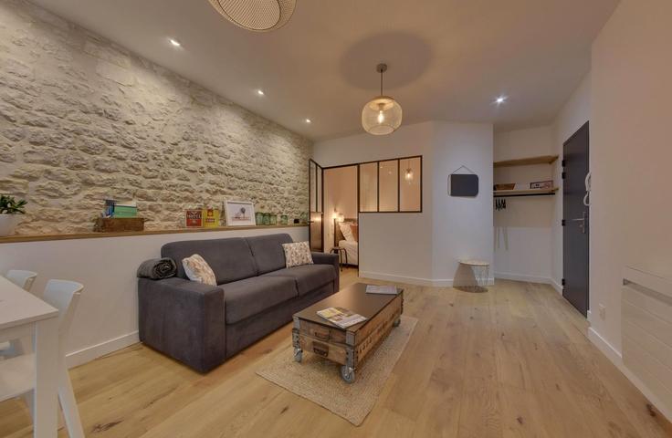 Elegantly designed living room with modern furnishings in an apartment at Building 41 Rue du Palais, La Rochelle, France - lockey-conciergerie - 1698663 in La Rochelle, La Rochelle