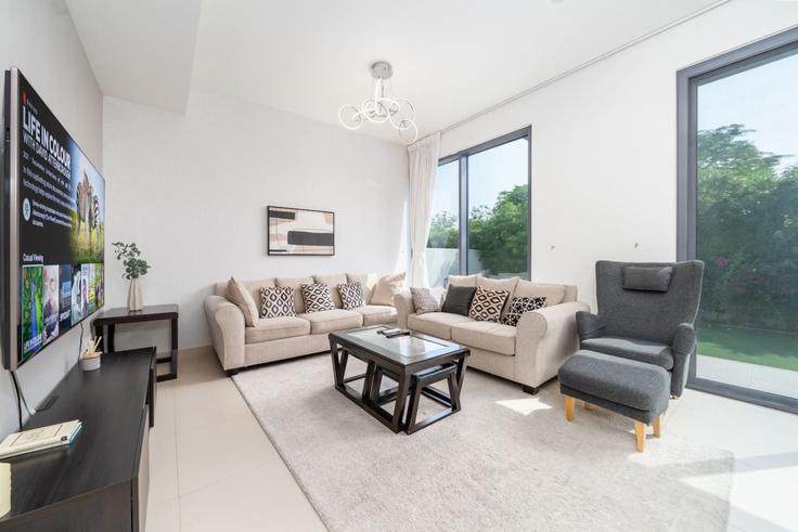 Elegantly designed living room with modern furnishings in an apartment at Building Unnamed Road - luxfolio-retreats-1 - 1639453 in Dubai Hills Estate, Dubai