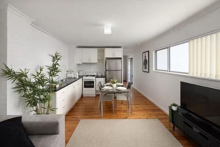 Salle de séjour élégante avec mobilier moderne dans un appartement à Building Eden Street - madecomfy - 1559969 à Footscray, Melbourne