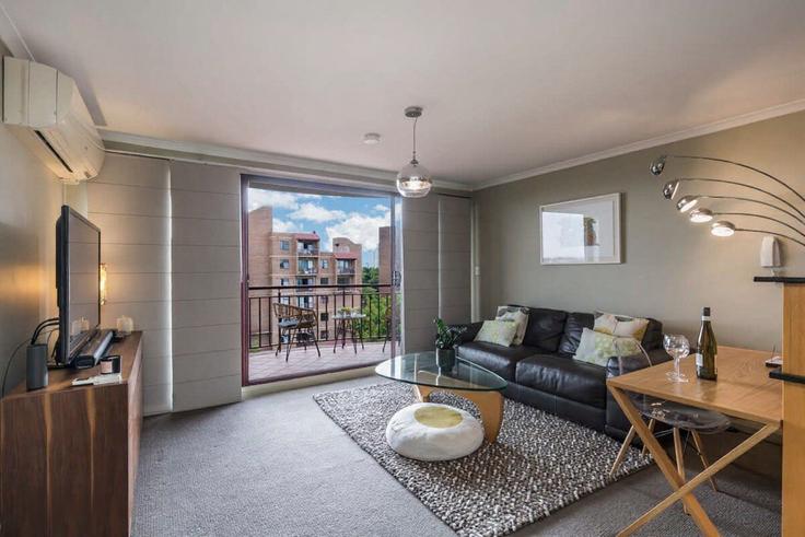 Elegantly designed living room with modern furnishings in an apartment at Building Riley Street - maisonnets - 1519950 in Surry Hills, Sydney