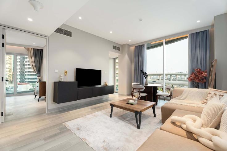 Elegantly designed living room with modern furnishings in an apartment at Building Marina Promenade - majestay - 1332414 in Dubai Marina, Dubai