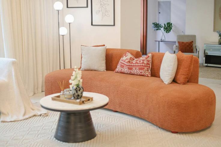 Elegantly designed living room with modern furnishings in an apartment at Building Tariaq Bedon Esm - manzil-life - 1382180 in Burj Khalifa, Dubai Elegantly designed living room with modern furnishings in an apartment at Building Tariaq Bedon Esm - manzil-life - 1382180 in Burj Khalifa, Dubai