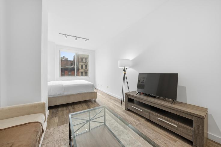 Elegantly designed living room with modern furnishings in an apartment at Building 3rd Avenue - matsuri-technologies-inc - 1467099 in Manhattan, New York Elegantly designed living room with modern furnishings in an apartment at Building 3rd Avenue - matsuri-technologies-inc - 1467099 in Manhattan, New York