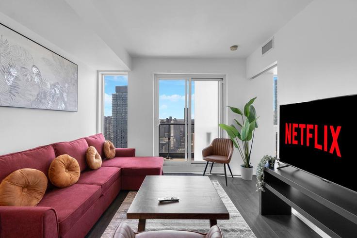 Salle de séjour élégante avec mobilier moderne dans un appartement à Building Jarvis Street - maxima-properties - 1403810 à Old Toronto, Toronto