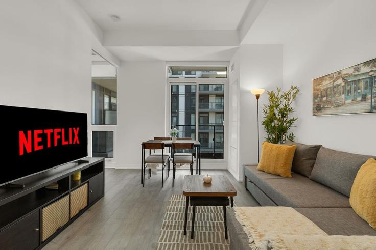 Elegantly designed living room with modern furnishings in an apartment at Building Jarvis Street - maxima-properties - 1560826 in Old Toronto, Toronto