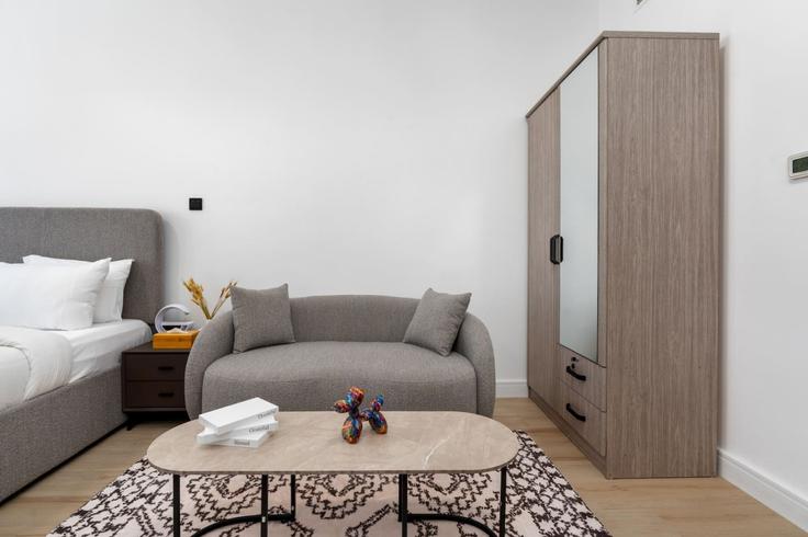 Elegantly designed living room with modern furnishings in an apartment at Building Tariaq Bedon Esm - medini-homes - 1333482 in Al Barsha South Fifth, Dubai