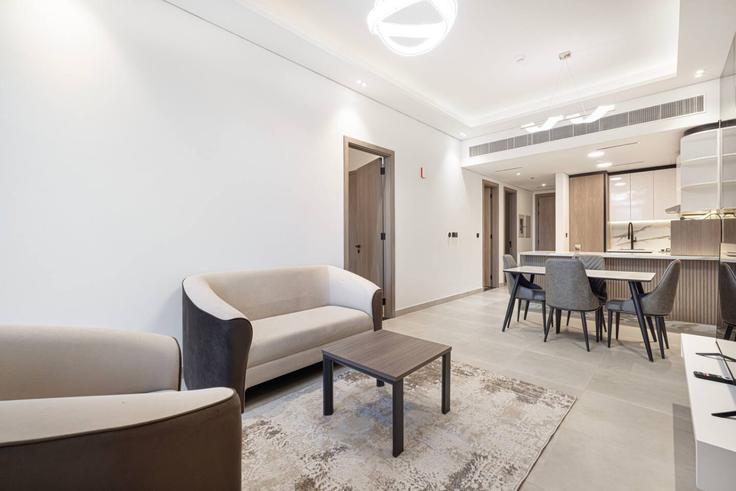 Elegantly designed living room with modern furnishings in an apartment at Building Tariaq Bedon Esm - medini-homes - 1333552 in Al Barsha South Fifth, Dubai