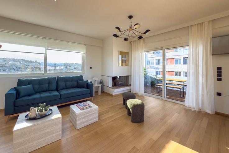 Elegantly designed living room with modern furnishings in an apartment at Building Ntourm - meno-property-management - 1346050 in Central Athens, Athens