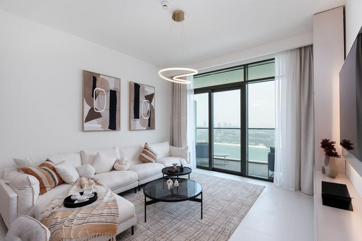 Elegantly designed living room with modern furnishings in an apartment at Building Tariaq Bedon Esm - mint-stay-homes-rental-llc - 1296438 - DXB in The Palm Jumeirah, Dubai Elegantly designed living room with modern furnishings in an apartment at Building Tariaq Bedon Esm - mint-stay-homes-rental-llc - 1296438 - DXB in The Palm Jumeirah, Dubai