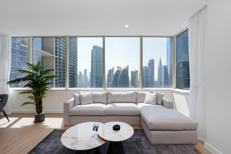 Elegantly designed living room with modern furnishings in an apartment at Building Al Mustaqbal Street - mint-stay-homes-rental-llc - 1296411 - DXB in Trade Center, Dubai Elegantly designed living room with modern furnishings in an apartment at Building Al Mustaqbal Street - mint-stay-homes-rental-llc - 1296411 - DXB in Trade Center, Dubai