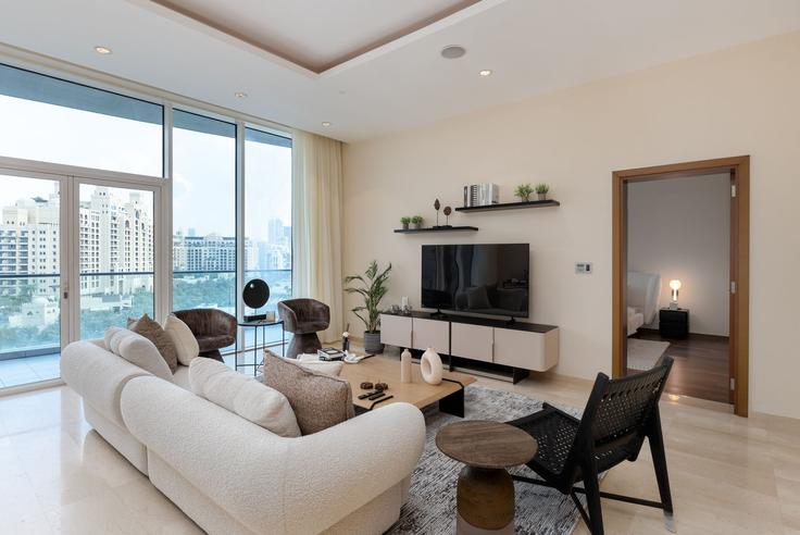 Elegantly designed living room with modern furnishings in an apartment at Building Tariaq Bedon Esm - mint-stay-homes-rental-llc - 1296469 - DXB in The Palm Jumeirah, Dubai Elegantly designed living room with modern furnishings in an apartment at Building Tariaq Bedon Esm - mint-stay-homes-rental-llc - 1296469 - DXB in The Palm Jumeirah, Dubai