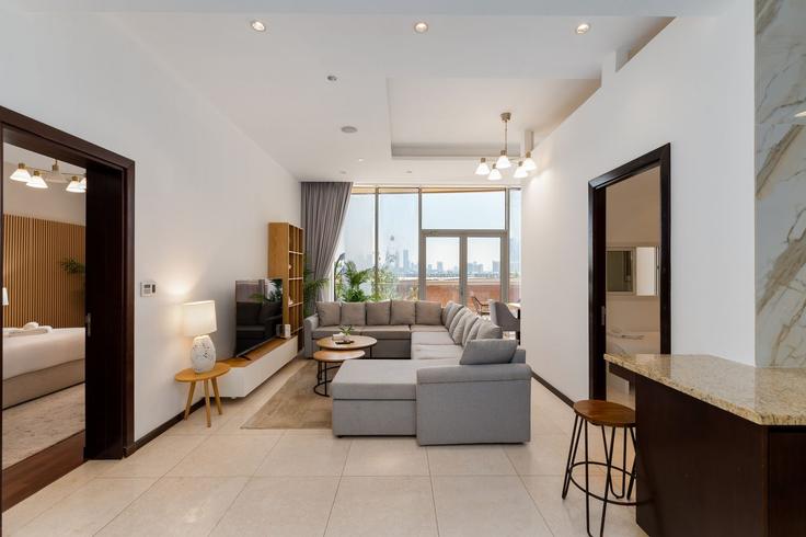 Elegantly designed living room with modern furnishings in an apartment at Building Tariaq Bedon Esm - mint-stay-homes-rental-llc - 1296495 - DXB in The Palm Jumeirah, Dubai Elegantly designed living room with modern furnishings in an apartment at Building Tariaq Bedon Esm - mint-stay-homes-rental-llc - 1296495 - DXB in The Palm Jumeirah, Dubai