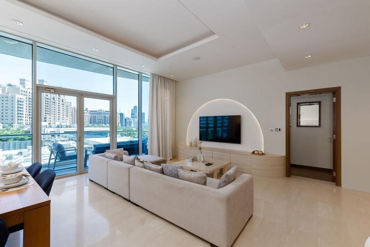 Elegantly designed living room with modern furnishings in an apartment at Building Tariaq Bedon Esm - mint-stay-homes-rental-llc - 1313975 - DXB in The Palm Jumeirah, Dubai Elegantly designed living room with modern furnishings in an apartment at Building Tariaq Bedon Esm - mint-stay-homes-rental-llc - 1313975 - DXB in The Palm Jumeirah, Dubai