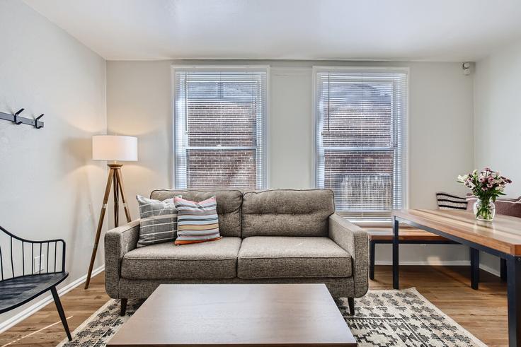 Elegantly designed living room with modern furnishings in an apartment at Building North Downing Street - modernmidstay - 1026256 - DEN in Denver, Denver