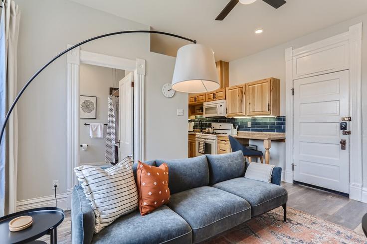 Elegantly designed living room with modern furnishings in an apartment at Building Detroit Street - modernmidstay - 1026240 - DEN in Denver, Denver