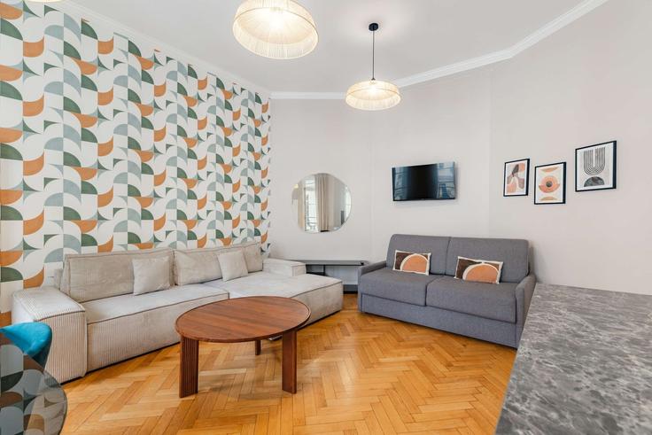 Elegant gestaltetes Wohnzimmer mit moderner Einrichtung in einer Wohnung im Building Rue de la Pompe - montaigne - 1346384 in 16th arrondissement, Paris