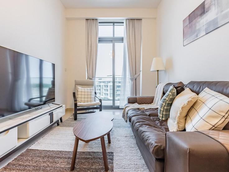Elegantly designed living room with modern furnishings in an apartment at Building Tariaq Bedon Esm - monty-holiday-home - 1494715 in Nad Al Sheba, Dubai