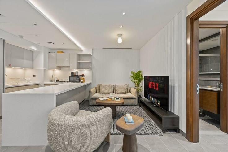 Elegantly designed living room with modern furnishings in an apartment at Building Tariaq Bedon Esm - monty-holiday-home - 1494721 in Nad Al Sheba, Dubai